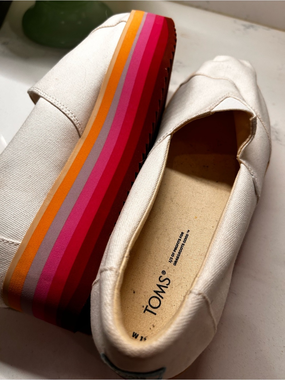 TOMS Off-White Canvas Slip-On Sneakers with Multicolor Stripe Sole